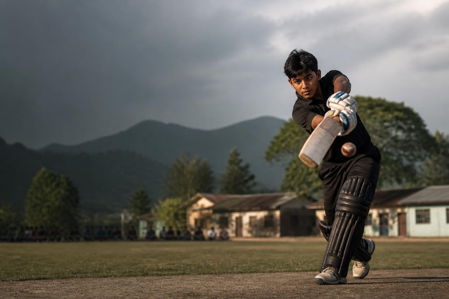 Young cricketer batting on an Assam school ground